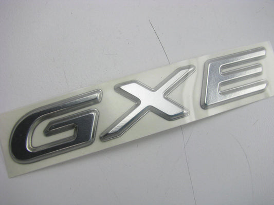 New OEM Trunk Lid *GXE* Badge Emblem Nameplate For 98-01 Altima 848969E400