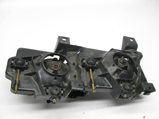 NEW - UNBOXED GM Left Headlamp W/ Bracket & Bulbs For 1988-1989 C/K Trucks