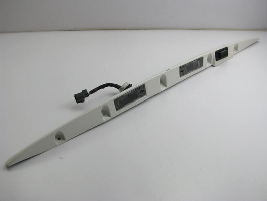 USED Lift Gate License Plate Light Housing Trim Stone White 99-04 Grand Cherokee
