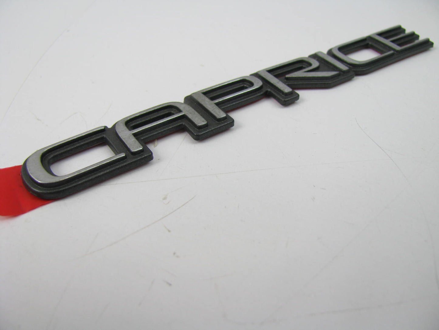 NEW - OUT OF BOX CAPRICE EMBLEM Name Plate Badge 5-1/2'' Long X 1/2'' High