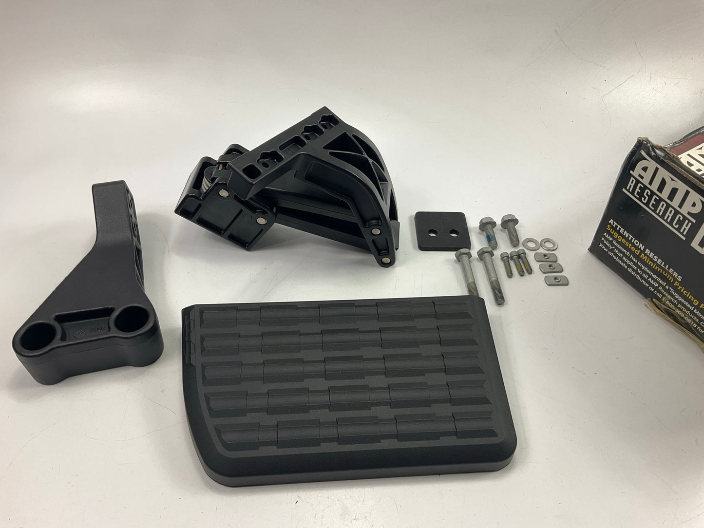 AMP Research 75306-01A BedStep Rear Bumper Truck Bed Access Step Powder Coated