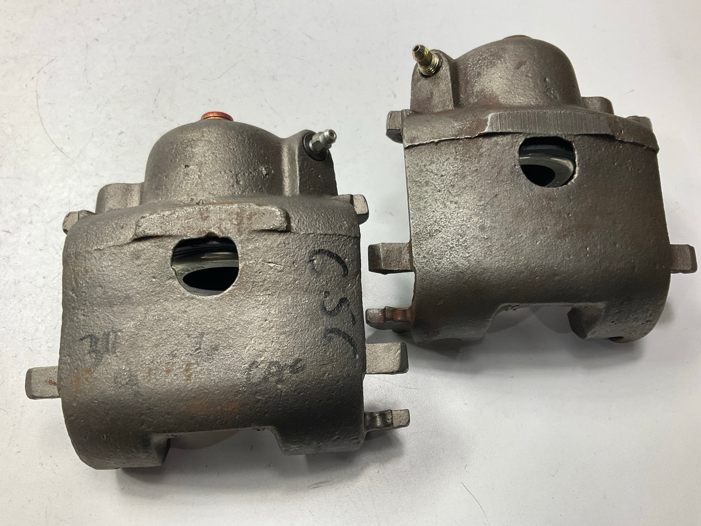 Reman. Front Brake Calipers W/ Pads - MISSING GUIDE PIN BOLTS