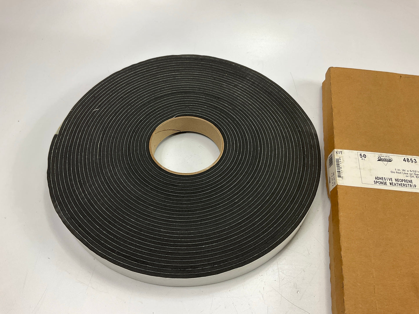 Auveco 4853 5/32'' X 1'' X 50' Peel-Bak Neoprene Sponge Weatherstrip Adhesive Seal