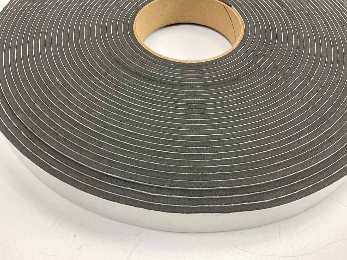 Auveco 4853 5/32'' X 1'' X 50' Peel-Bak Neoprene Sponge Weatherstrip Adhesive Seal