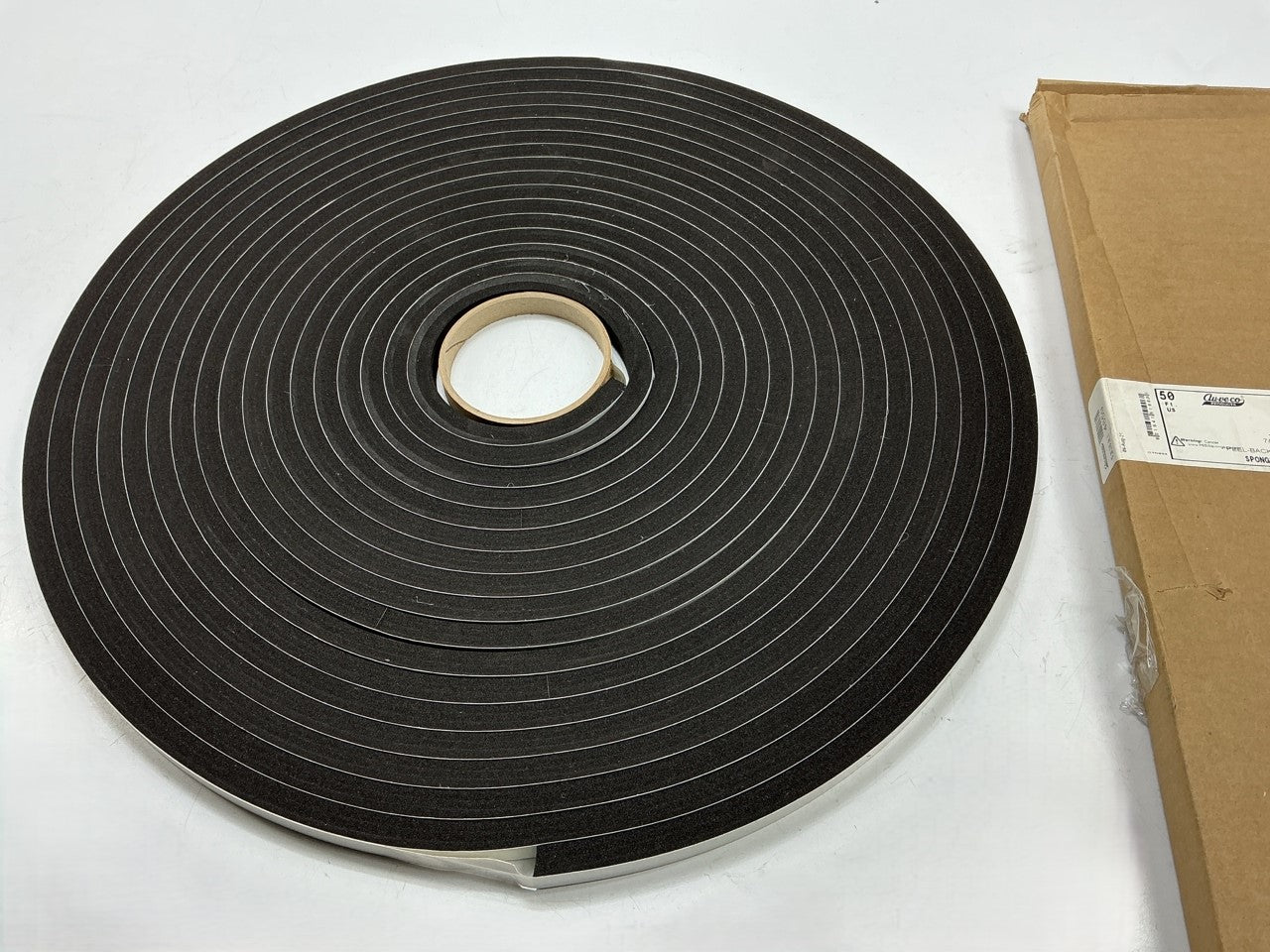 Auveco 7/16'' X 1/2'' X 50 Feet Peel-Bak Neoprene Sponge Weather Stripping Seal