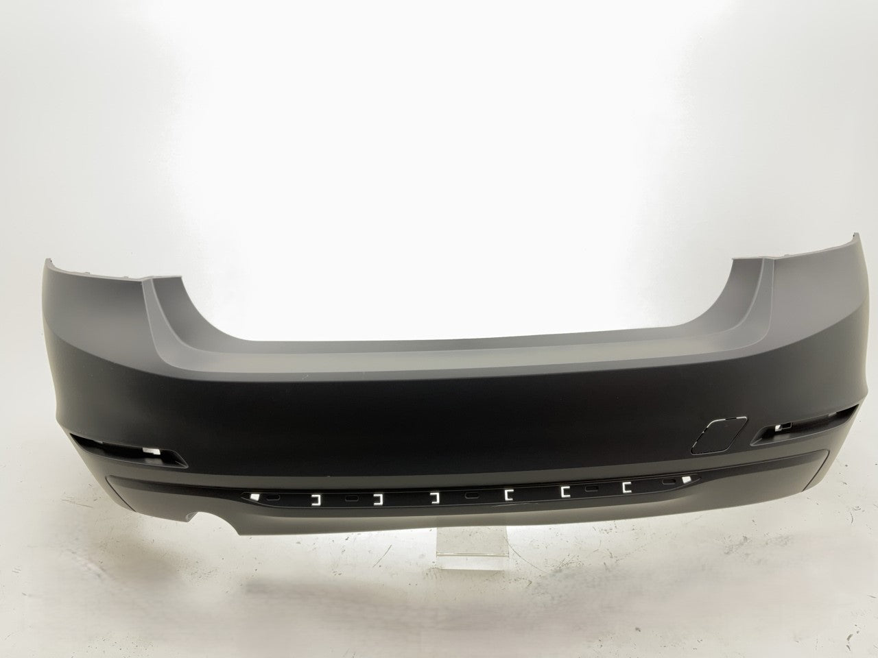 New 2012 BMW 328i 335i Rear Bumper Cover (Without Park Assist Sensor Holes)