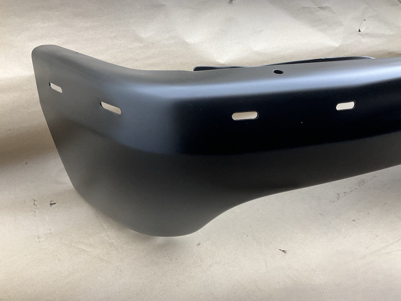 GM1002375 Front Black Steel Bumper - 1999-02 Silverado 1500, 00-06 Suburban 1500