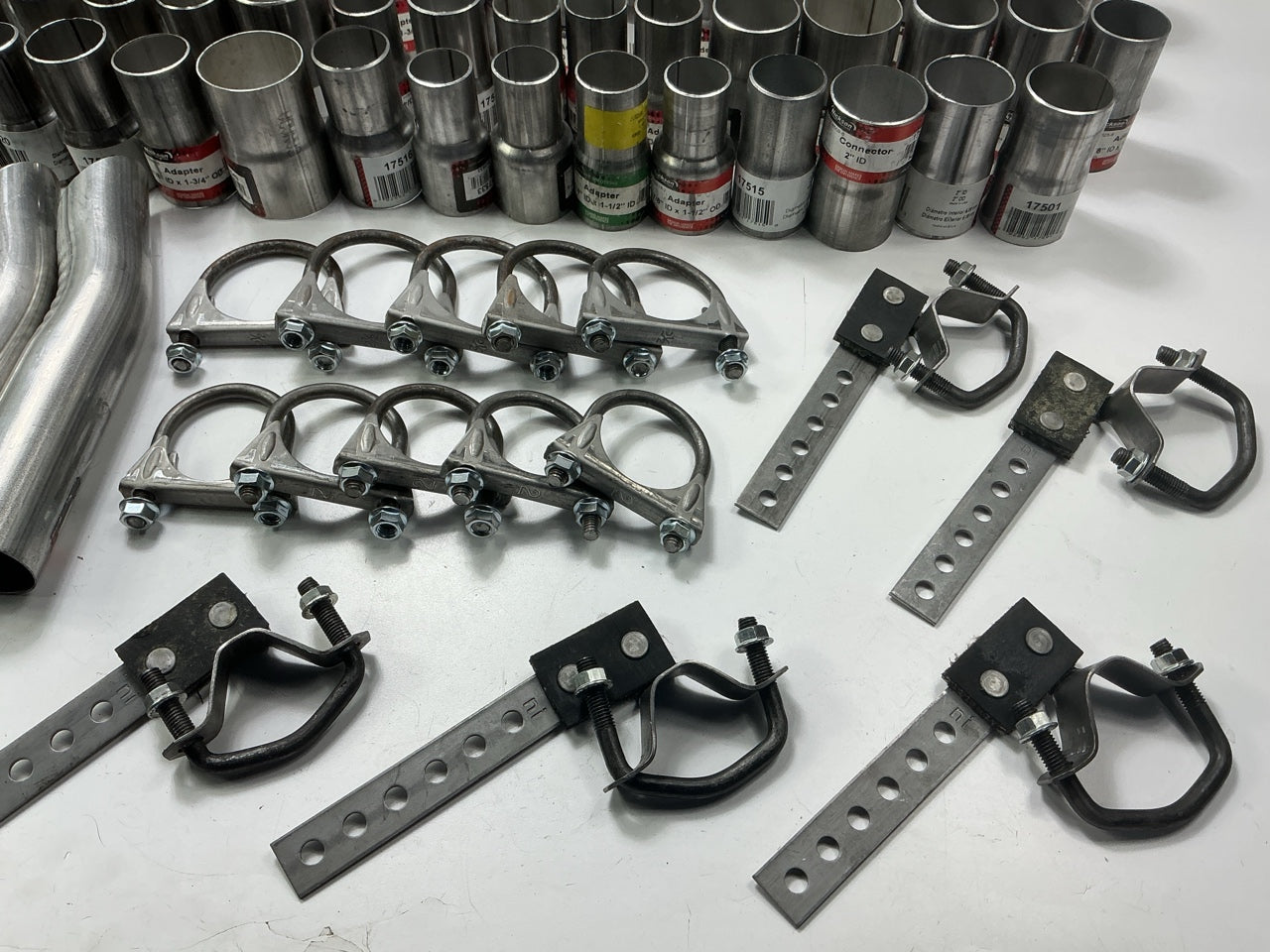 110 Piece Exhaust Component Lot: Common Adapters, Exhaust Pipe Elbows & Clamps
