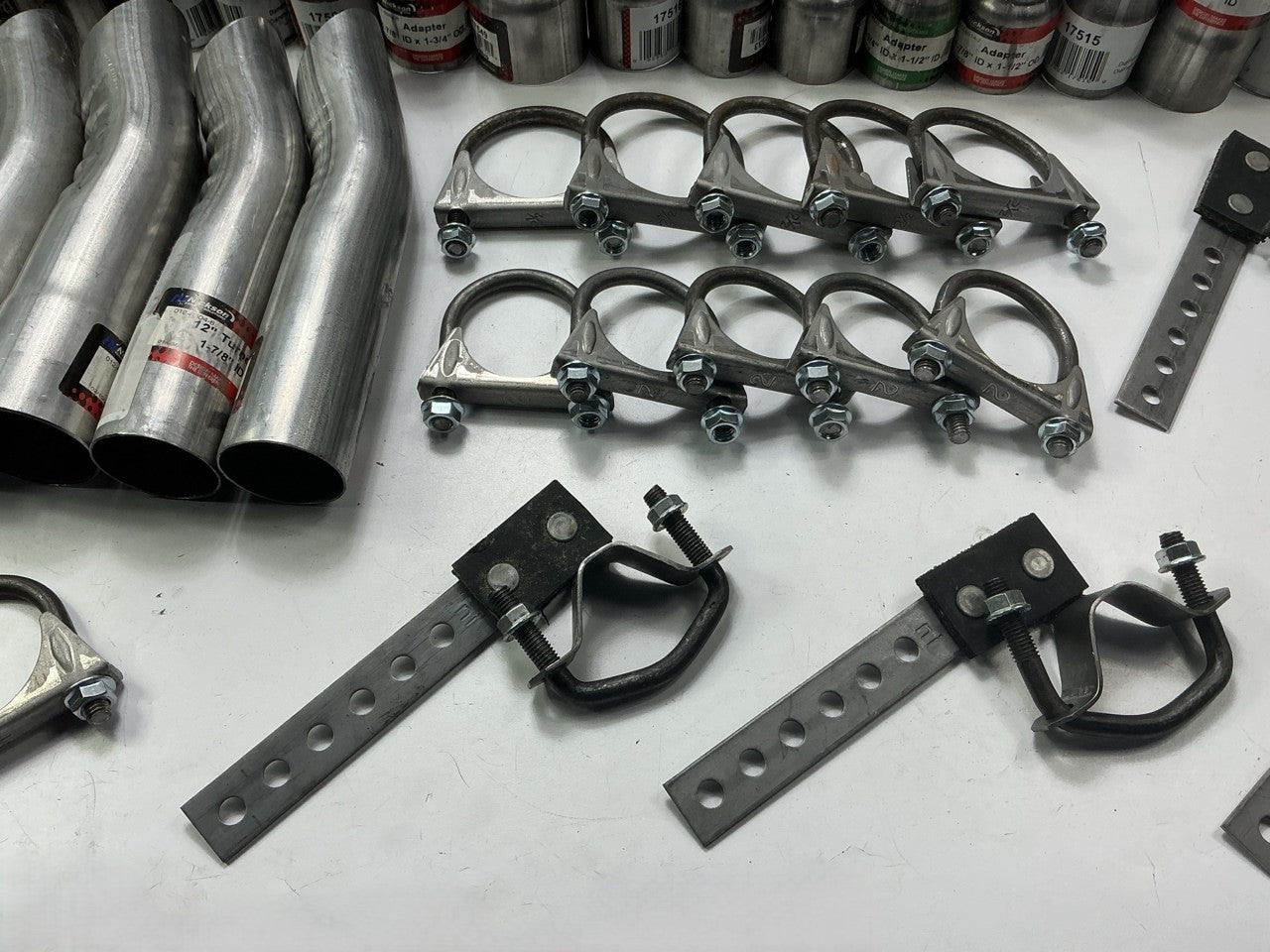 110 Piece Exhaust Component Lot: Common Adapters, Exhaust Pipe Elbows & Clamps