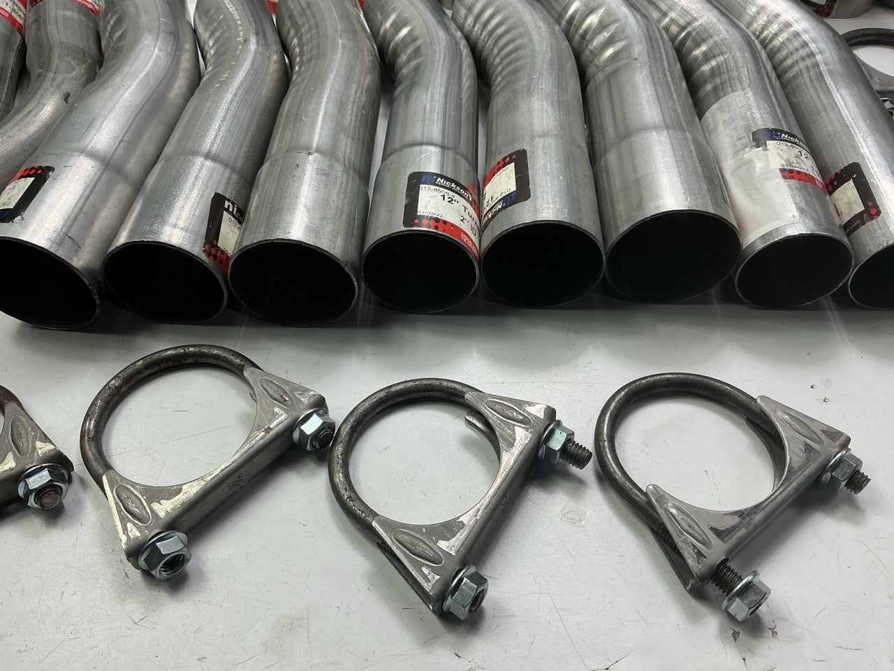 110 Piece Exhaust Component Lot: Common Adapters, Exhaust Pipe Elbows & Clamps