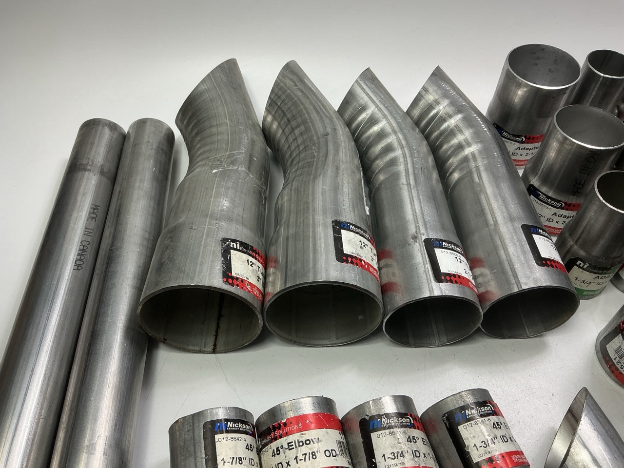 110 Piece Exhaust Component Lot: Common Adapters, Exhaust Pipe Elbows & Clamps