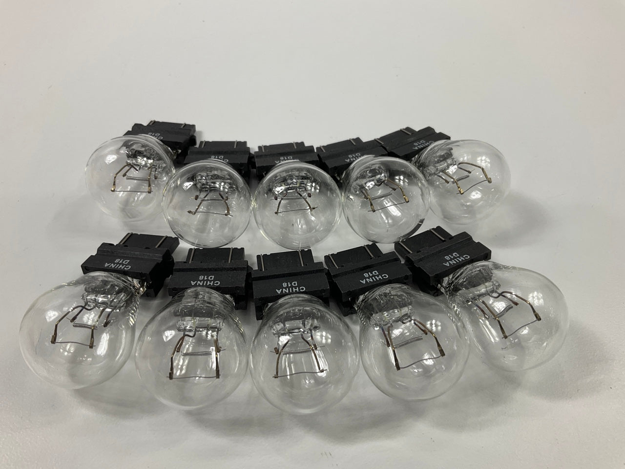 PACK OF 10 - Champion 4057LL Tail Light Bulbs / Turn Signal Light Bulbs