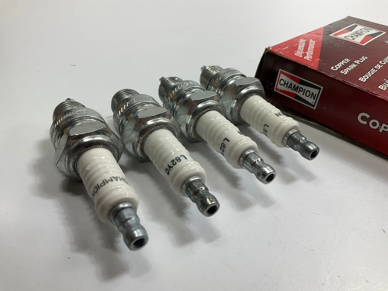 (4) Champion #328 L82YC, Copper Plus Spark Plug