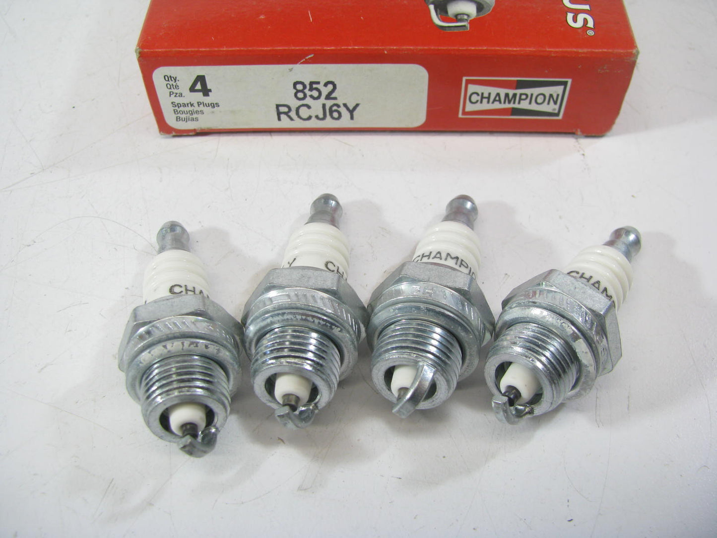 (4) Champion RCJ6Y 852 Ignition Spark Plugs - 14mm Thread 9.5mm Reach 19mm Hex