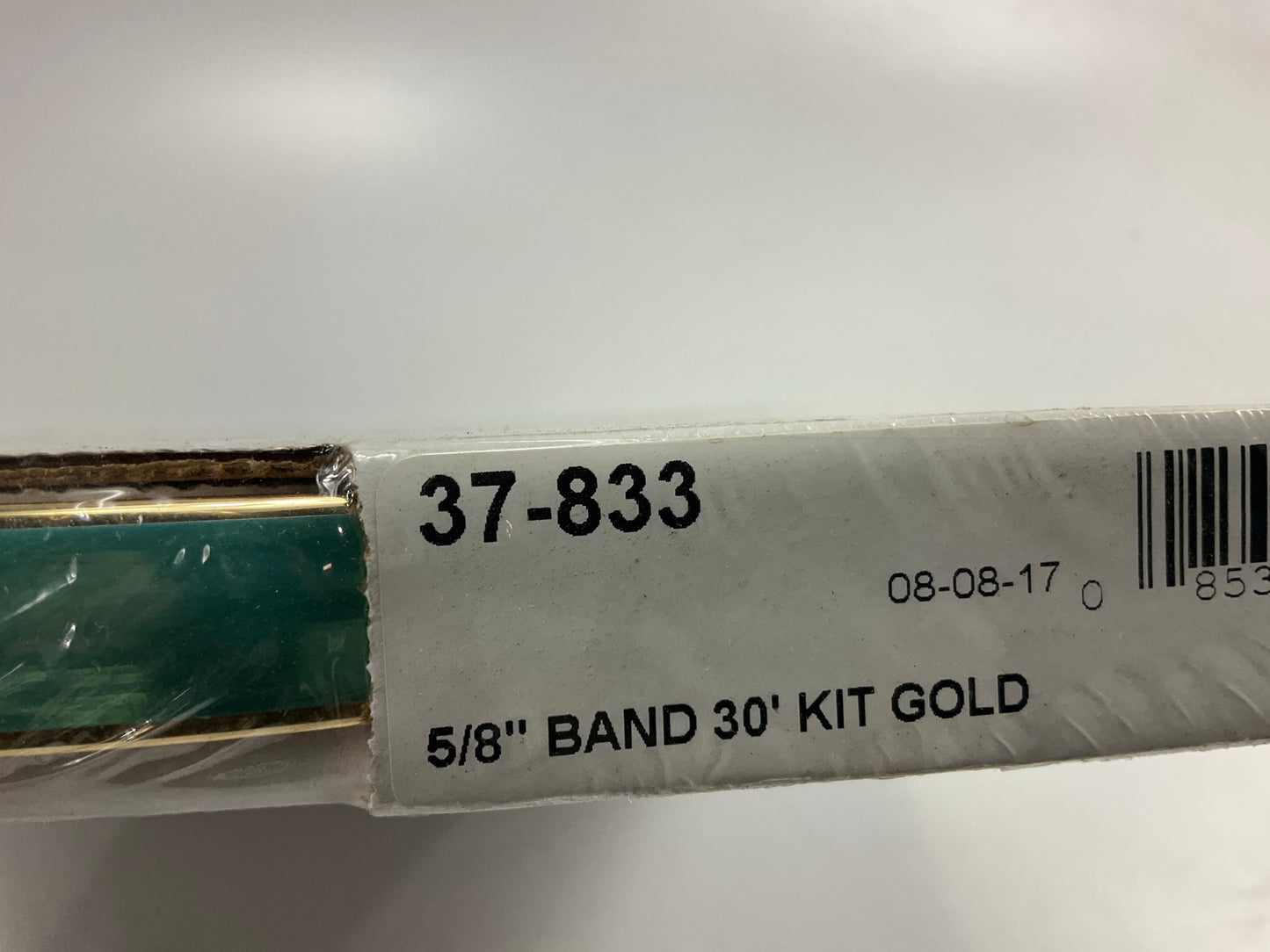 Cowles 37-833 5/8'' Band Wheel Well Molding, 30 Feet - Gold Moulding Strip