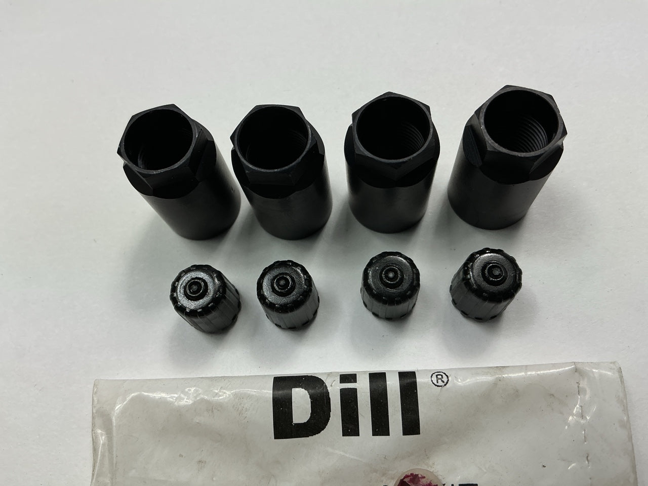 (4) Dill 733K Black TPMS Accessory Kit: Hex Nut And Valve Cap Only