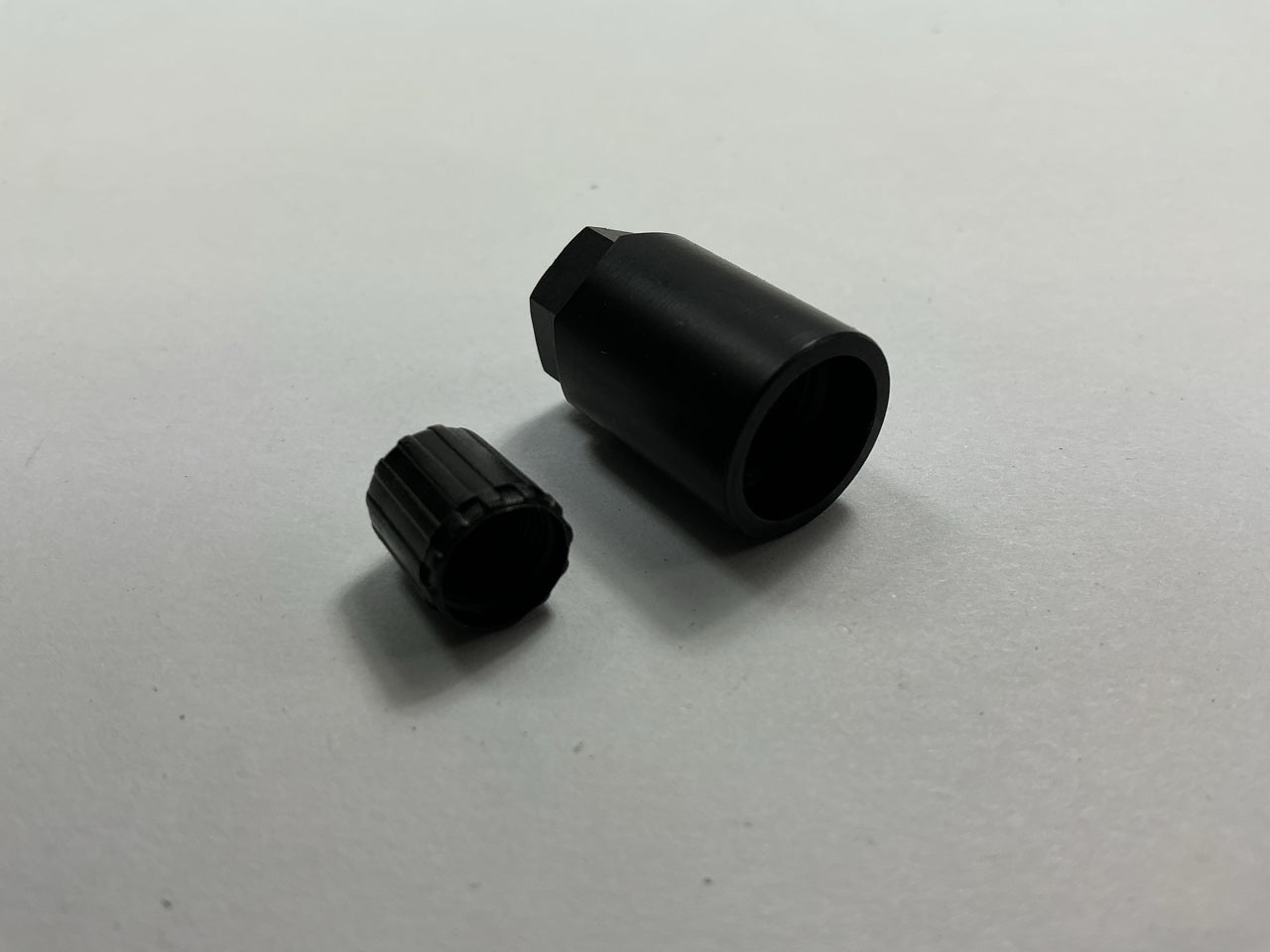 (4) Dill 733K Black TPMS Accessory Kit: Hex Nut And Valve Cap Only