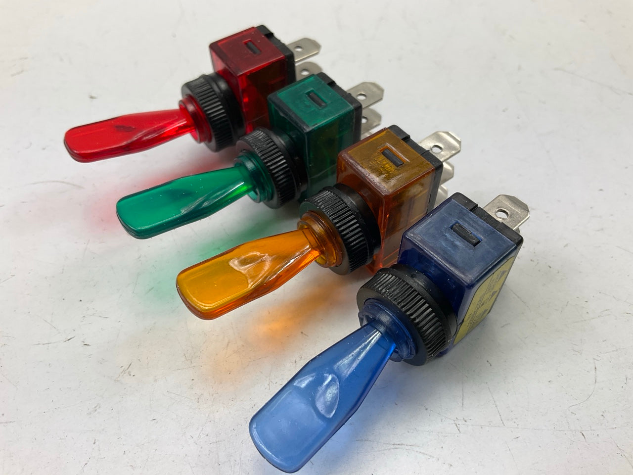 Dorman 86922 Toggle Switch Panel Kit: 4 Multi-colored Toggle Switches & Bezel