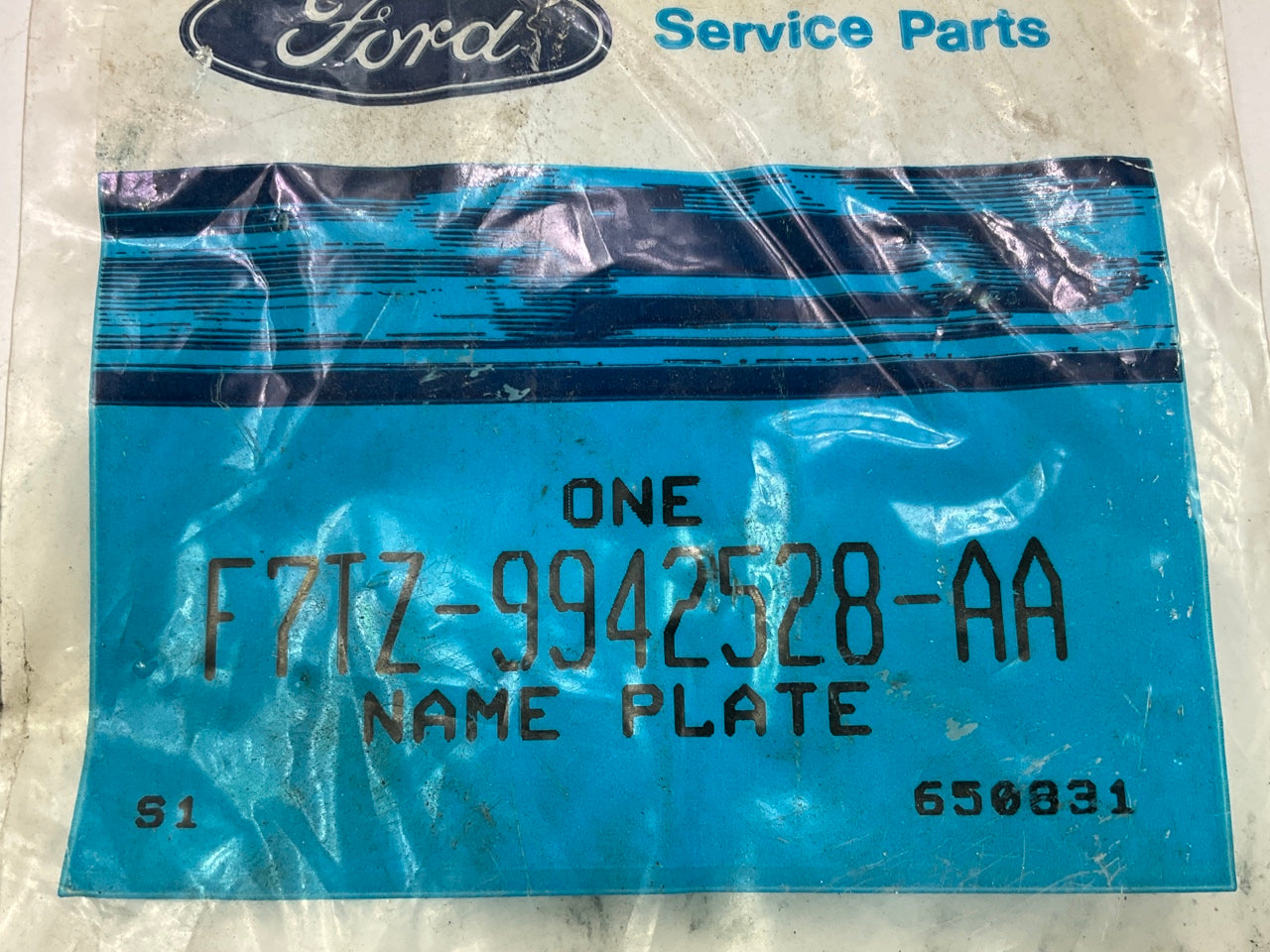 NEW - OEM Ford F7TZ-9942528-AA Front Emblem ''Ford'' Nameplate Name Plate