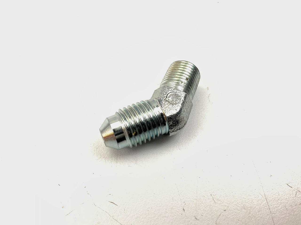 Gates G60497-0402 7/16''-20 Male JIC 37 Flare To Male Pipe NPTF 45 Degree Adapter