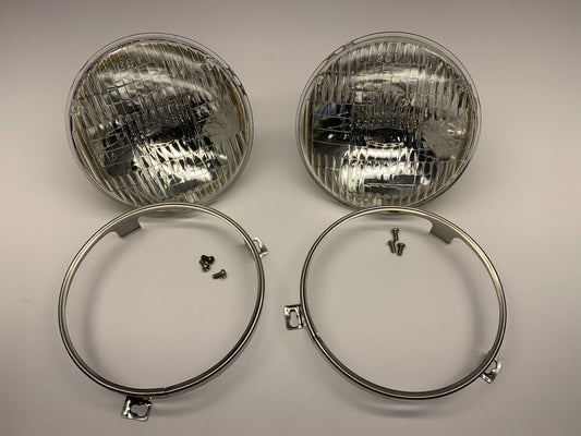 (2) NOS Genuine OEM IKI 5.75'' Headlight Head Lamps PAIR + Chrome Mounting Rings