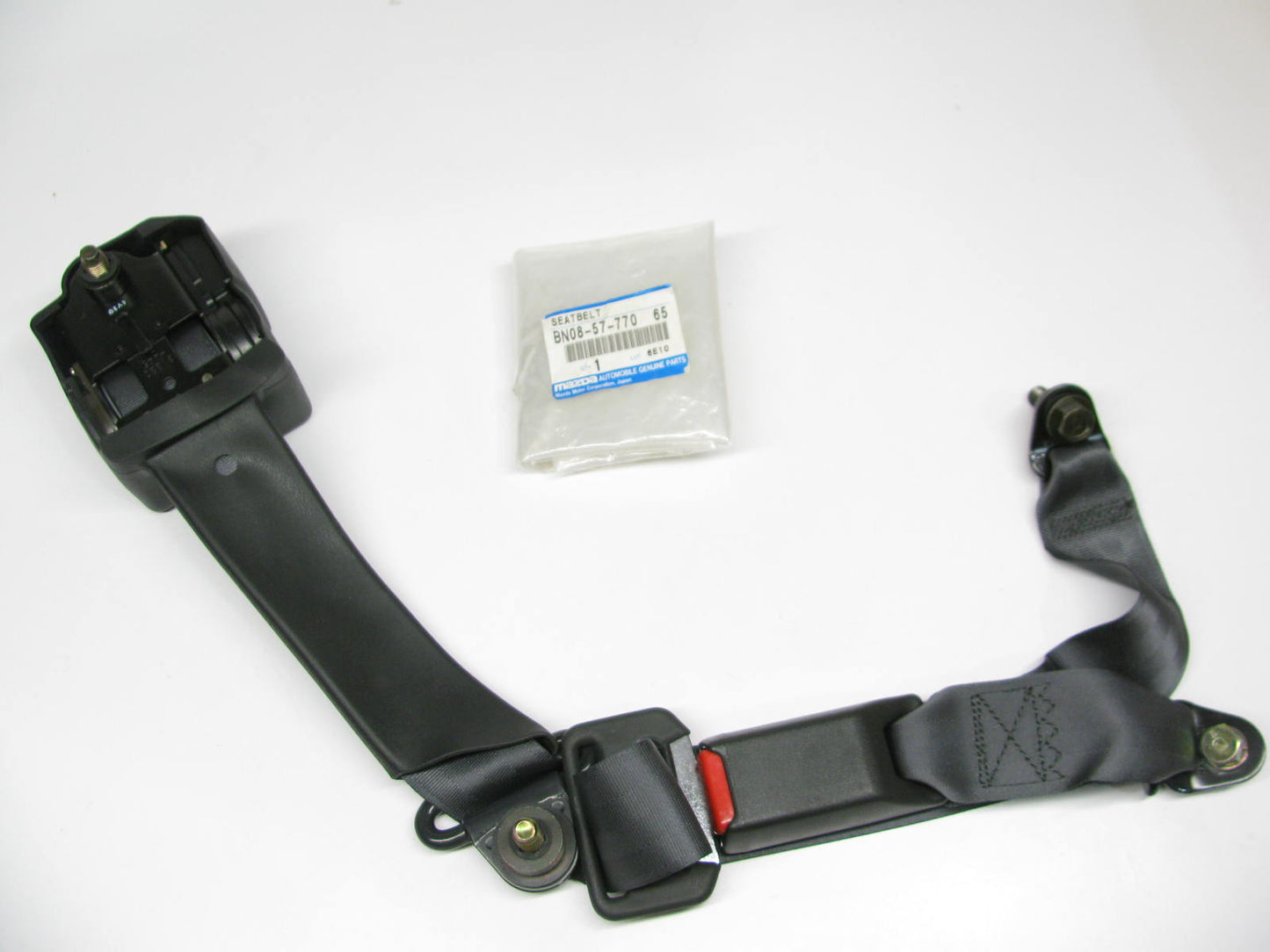 NOS - OEM Mazda BN08-57-770-65 Rear Left Seat Belt Retractor For 1988-1989 323