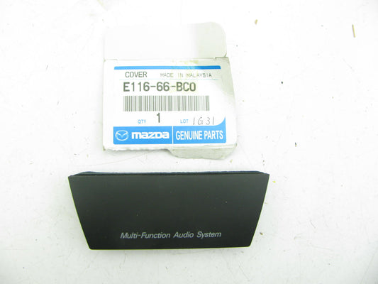 NEW - OEM Mazda E116-66-BC0 Audio Panel Escutcheon 2001-06 Tribute 02-03 Protege