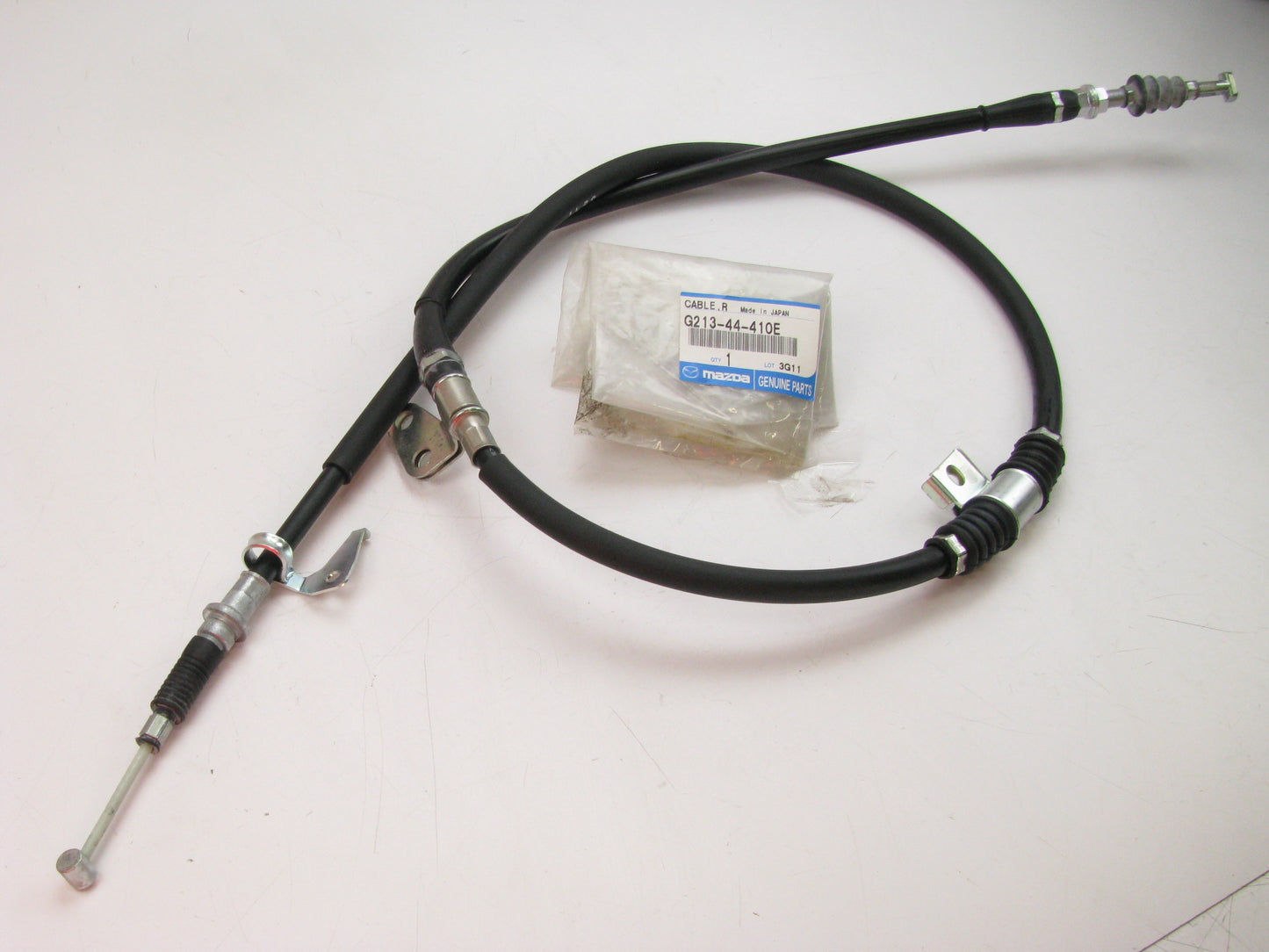 NEW GENUINE OEM G21344410E REAR RIGHT Parking Brake Cable 88-92 Mazda 626