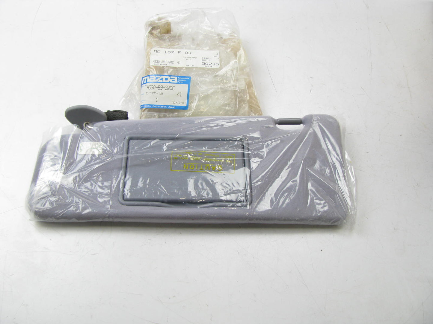 NEW - OEM Mazda HG30-69-320C-41 Front Left Sun Visor HE9 Gray 1992-94 929