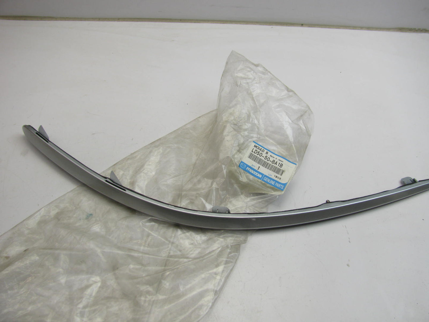 NEW - OEM Mazda LD5050BA1B Front Bumper Cover Molding Right 2002-2003 MPV
