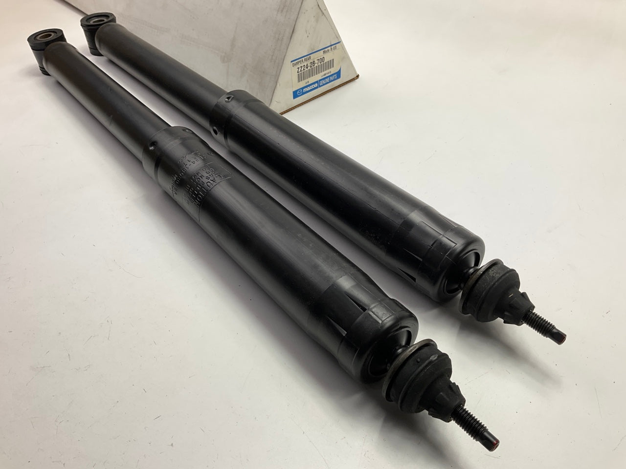 (2) NEW GENUINE OEM Mazda ZZ24-28-700 Rear Shock Absorbers