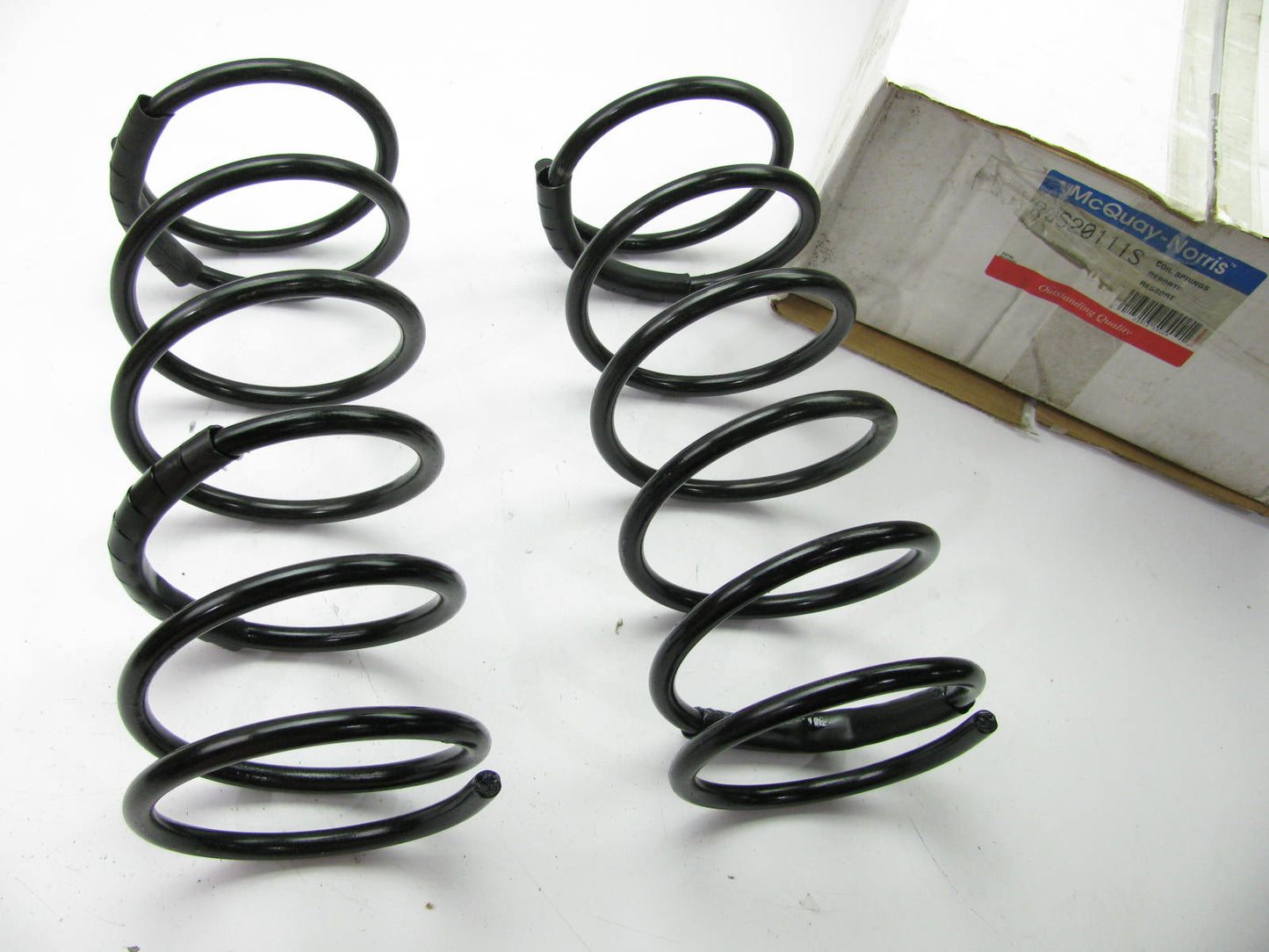 Mcquay-norris RCS20111S REAR Coil Springs For 96-06 Taurus Sable