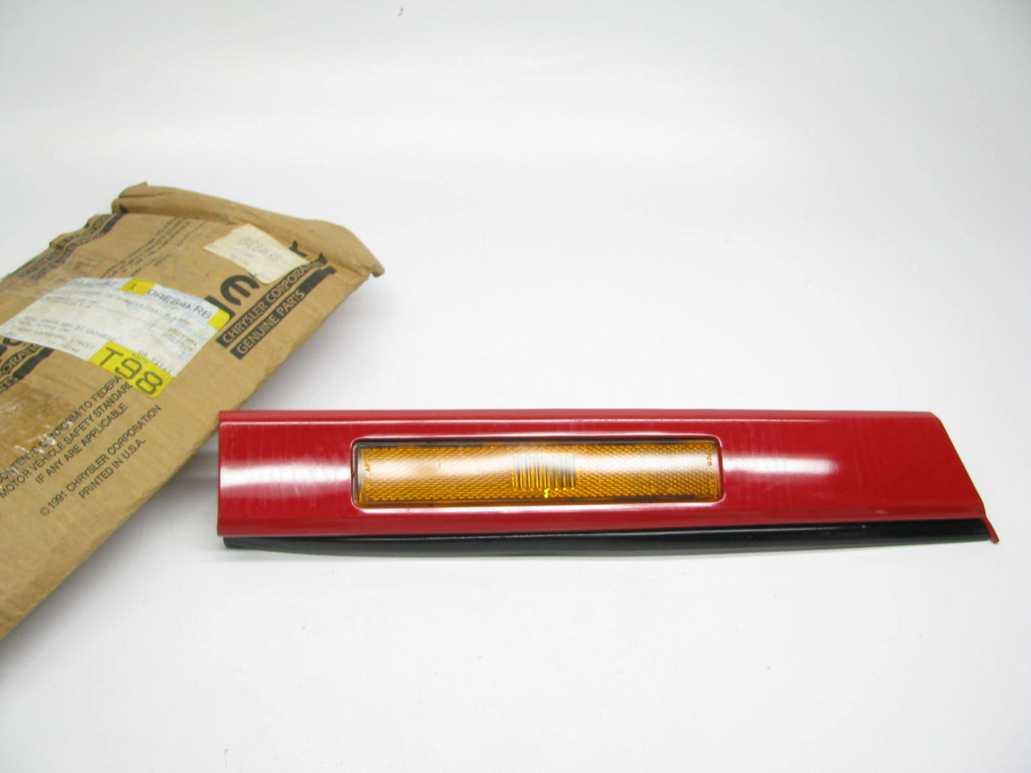 NEW - OEM Mopar AE84KRB Front Bumper Right Reflector (red) For 1991-1995 LeBaron
