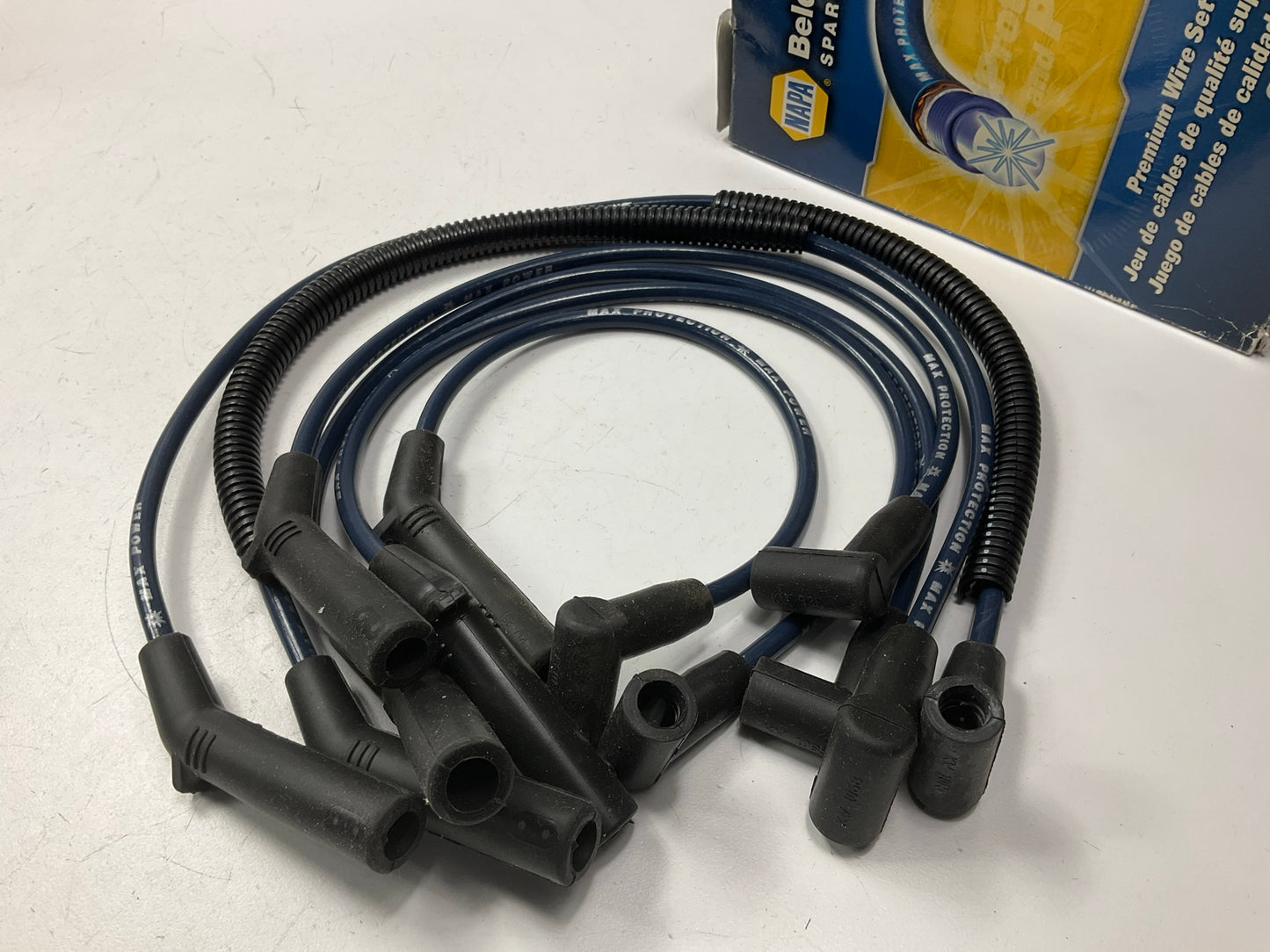 Napa 700438 Ignition Spark Plug Wire Set - 7mm, Blue Cables, Black Boots