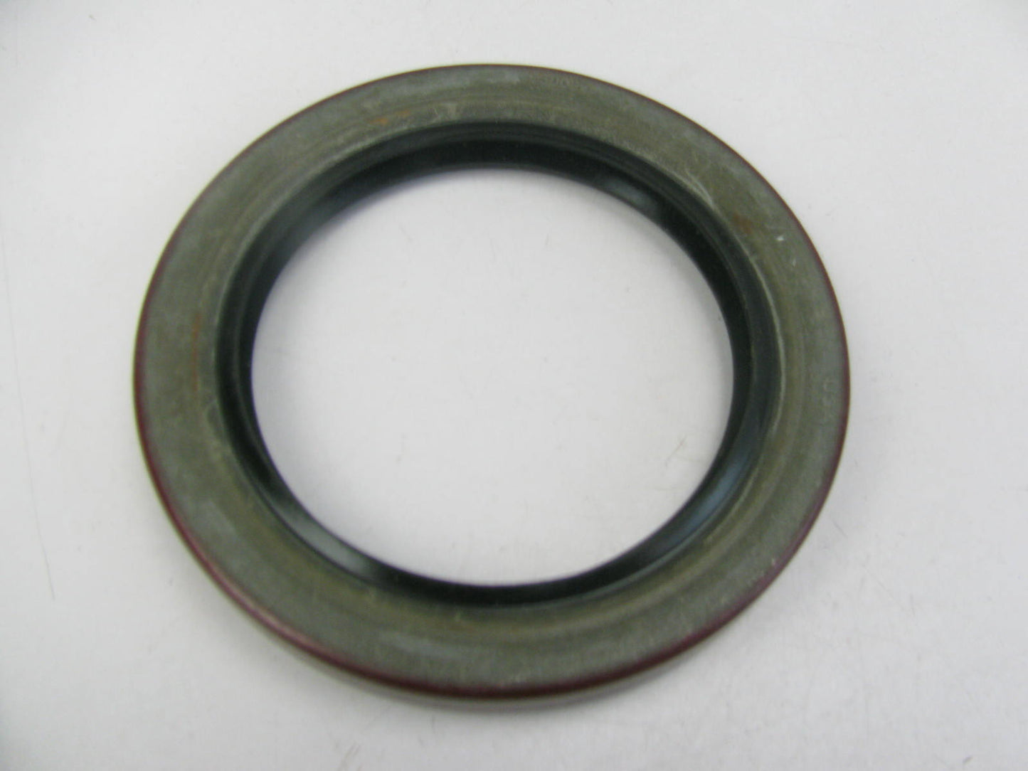 National 415009N Wheel Seal - 3.8765'' OD X 2.7500'' ID X 0.468'' Wide
