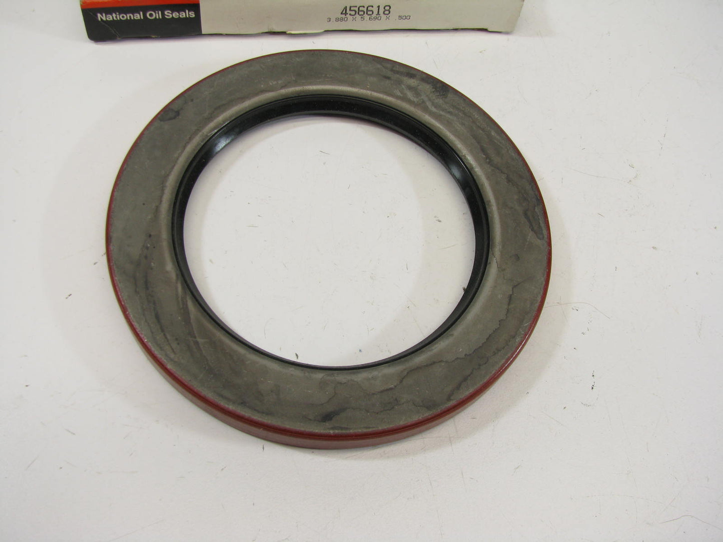 National 456618 Rear Wheel Oil Seal - 5.690'' OD X 3.880'' ID X 0.500'' Wide