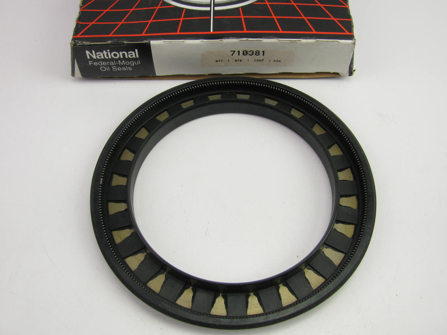 National 710381 Oil Seal - 6.693'' OD X 4.882'' ID X 0.571'' Wide