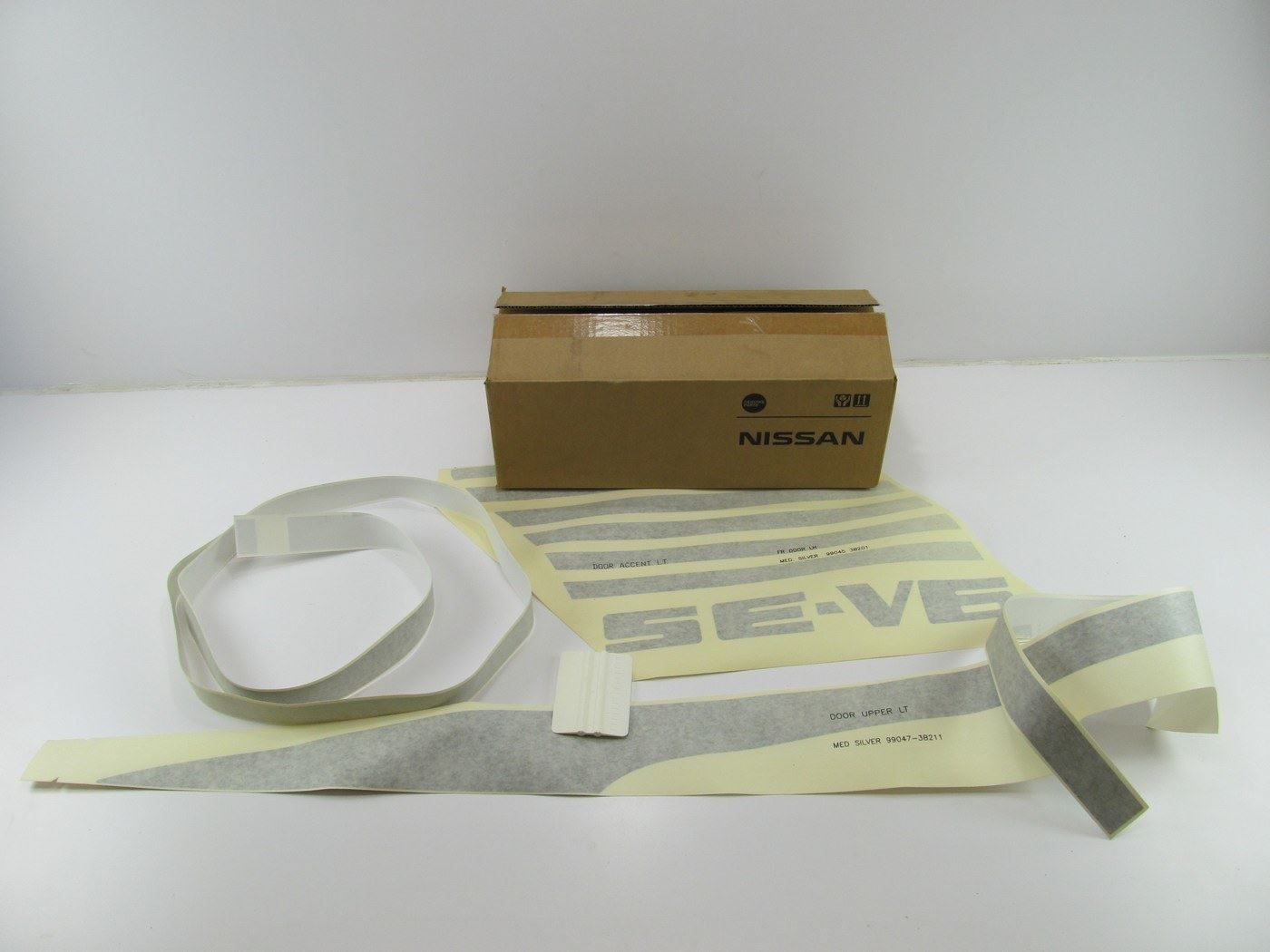 NEW - OEM K90393B201 Left Drivers Stripe Kit For 92-97 Nissan D21 SE V6 Reg. Cab