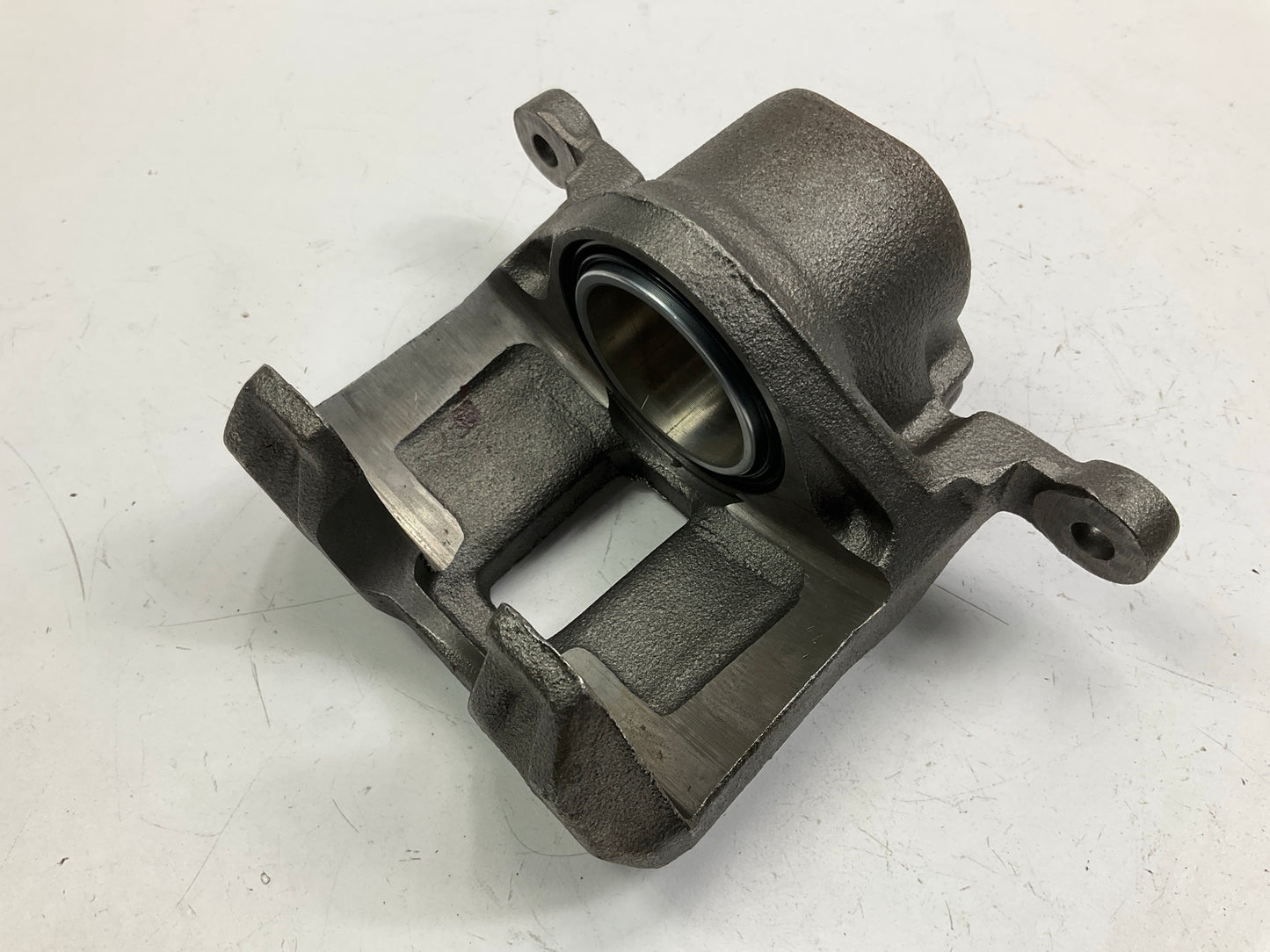 MISSING MOUNTING BRACKET - REMAN. Nugeon 99-00944A Front Left Disc Brake Caliper