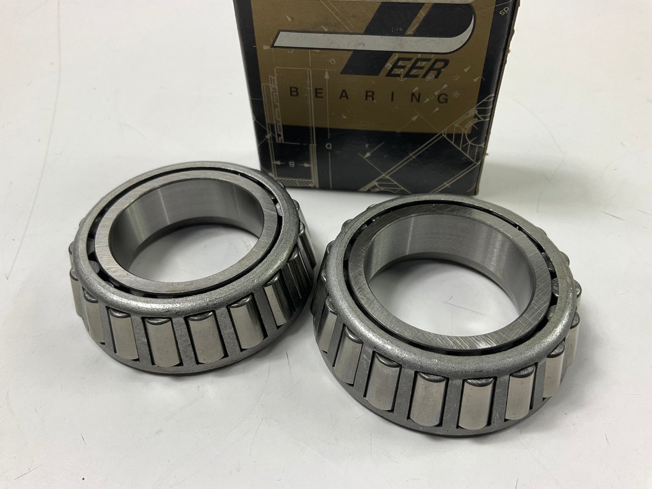 (2) Peer LM48548 Front Outer Wheel Bearings