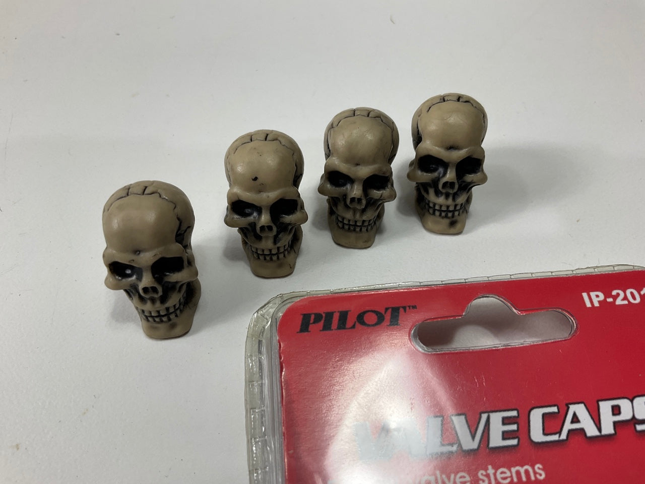 Pilot IP-2011 Brown Bone-Z Skull Wheel Valve Stem Caps - 4 PACK