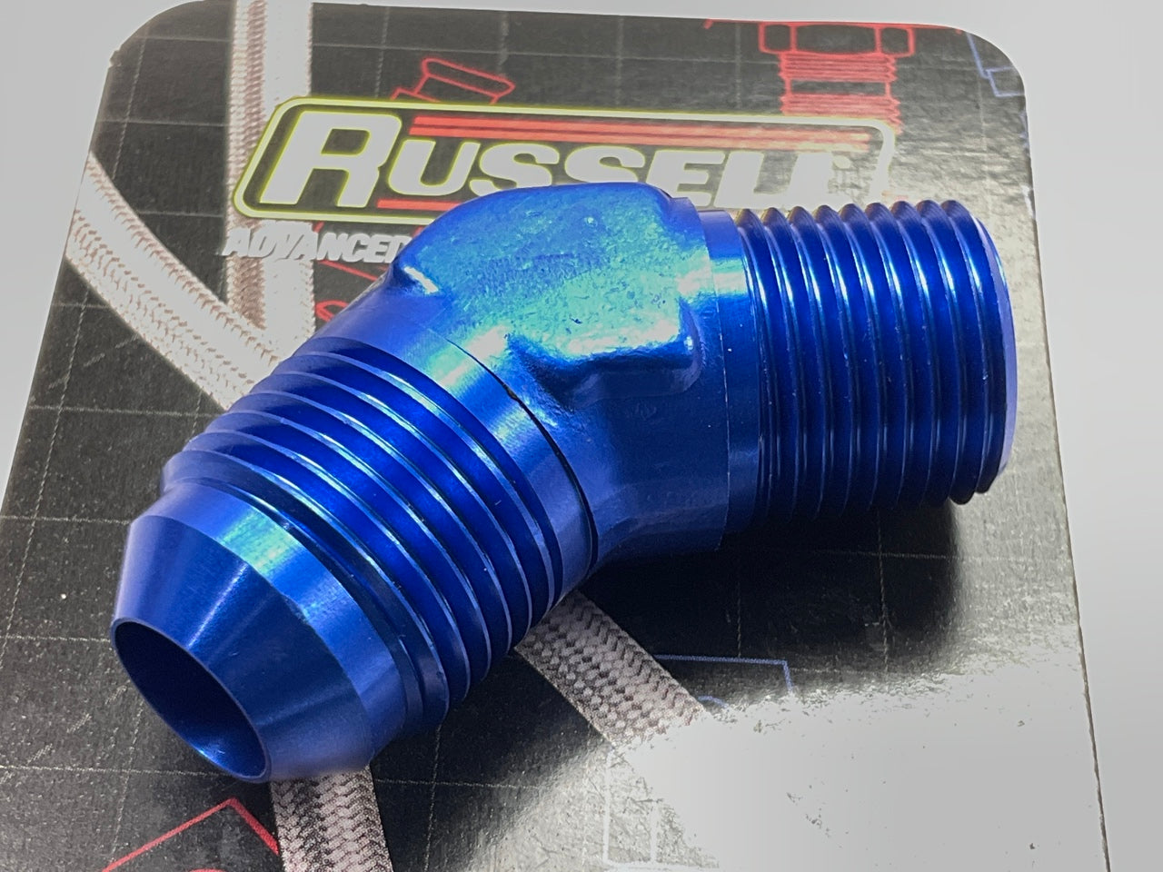 Russell 660960 8AN 45 Degree Flare To 3/8'' Pipe Adapter Fitting With Blue Finish