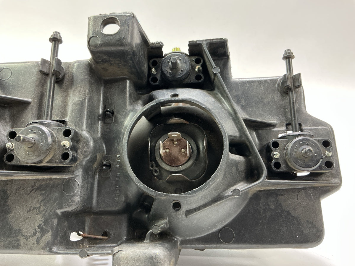 Used Good OEM GM 16506927 Left Headlamp W/ Bracket & Bulbs 1988-1989 C/K Trucks
