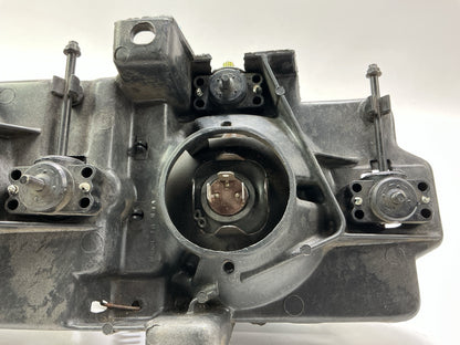 Used Good OEM GM 16506927 Left Headlamp W/ Bracket & Bulbs 1988-1989 C/K Trucks