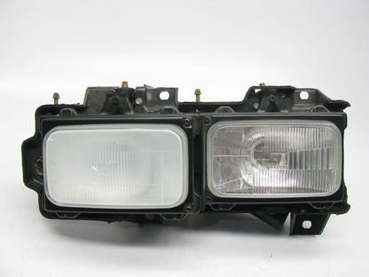 NEW - UNBOXED GM Left Headlamp W/ Bracket & Bulbs For 1988-1989 C/K Trucks