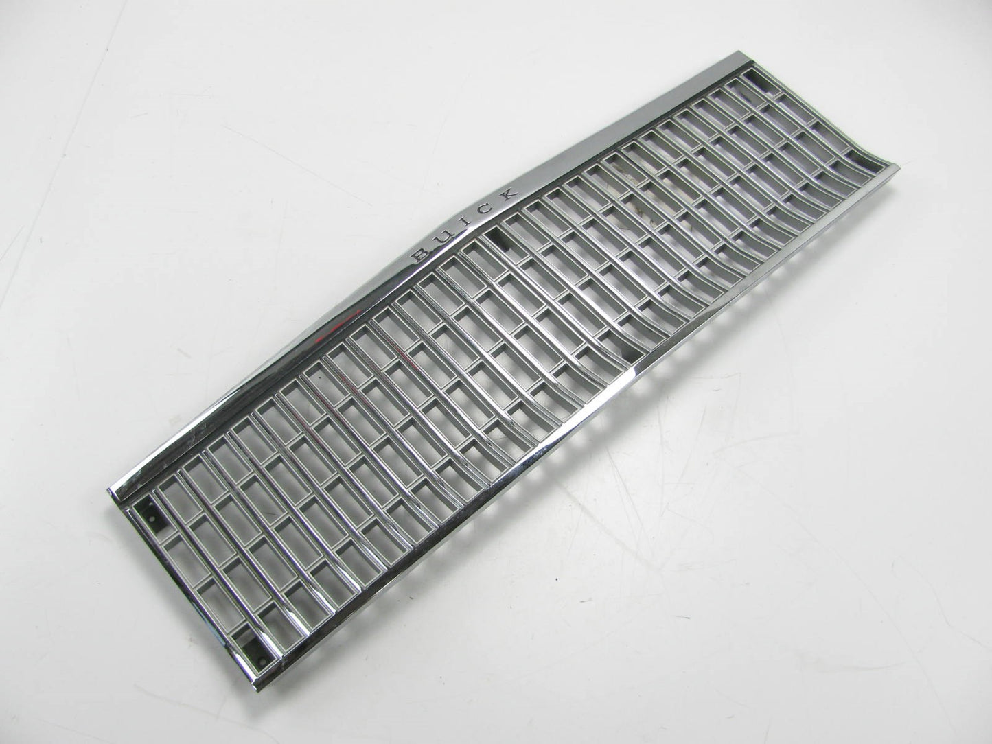 NEW - OUT OF BOX - OEM GM Front Grille 1982-1985 Buick Skylark (SOME TARNISHING)