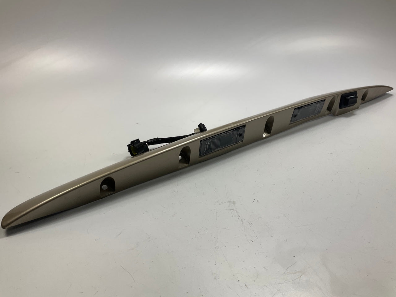 USED - 55155134AD Lift Gate License Plate Trim Champagne 99-04 Grand Cheroke