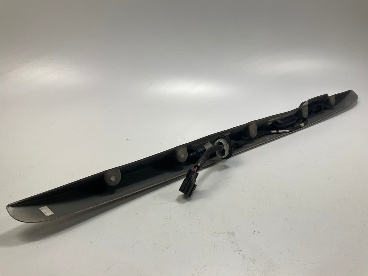 USED - 55155134AD Lift Gate License Plate Trim Champagne 99-04 Grand Cheroke