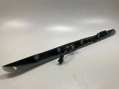 USED - 55155134AD Lift Gate License Plate Trim Champagne 99-04 Grand Cheroke