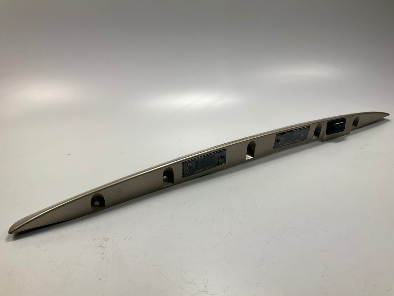 USED - 55155134AD Lift Gate License Plate Trim Champagne 99-04 Grand Cheroke